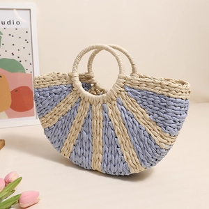Handcrafted semicircular straw tote with blue stripes and round handles for summer beach