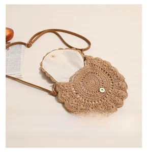 Detail of the magnetic buckle and lining inside the woven cotton crossbody beach bag