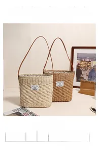 Close-up of square straw tote bags with size specs: 27cm width, 23cm height, 28cm handle