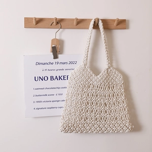 Elegante borsa a tracolla in cotone intrecciato color crema con maglia a rombi per la spiaggia