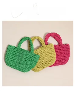 Detailed close-up of woven cotton rope handbags in green, yellow and rose red