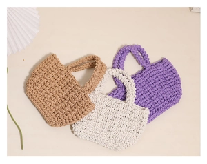Detailed knit texture of mini handmade crochet bags in khaki, cream, and lavender colors