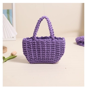 Detail of purple handmade woven tote bag with 3D honeycomb texture and thick rope handles
