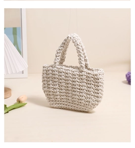 Close-up of beige crochet handbag with V-shaped knitting texture and tulip decor