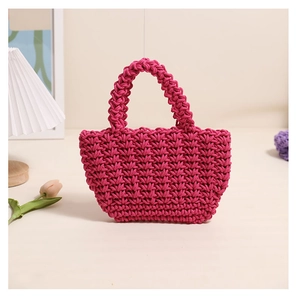 Detailed close-up of rose red hand-woven cotton tote bag with intricate crochet texture