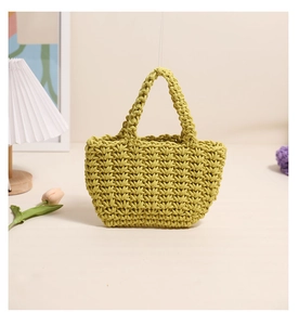 Close-up of green woven tote bag showing detailed V-shaped cotton crochet texture