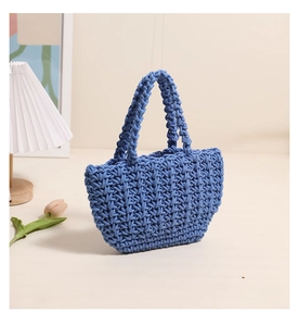 Detailed close-up of light blue cotton rope hand-woven tote bag with honeycomb texture
