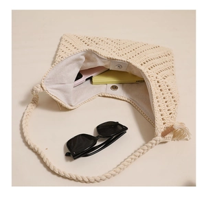 Detail view of woven cotton bag interior with metal magnetic closure and lining
