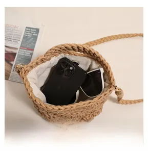 Top view of handwoven cotton bucket bag showing spacious interior with phone and sunglasses
