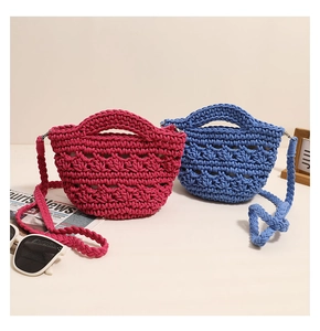 Detail of woven cotton crossbody bags in vibrant fuchsia and royal blue with hollow texture