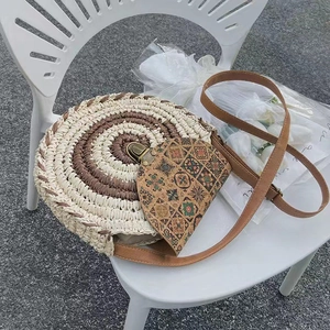 Handcrafted round straw crossbody bag with spiral texture and floral pattern flap