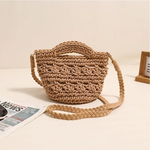 Handcrafted khaki woven crossbody bag with hollow honeycomb texture for beach vacation