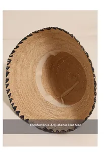 Detail view of the comfortable adjustable inner band of the woven raffia sun hat