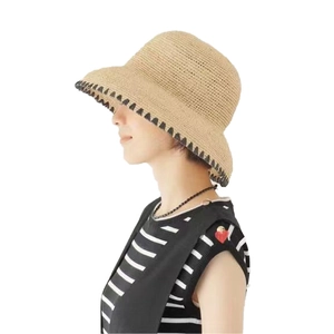 Raffia sun hat with black stitch detail for beach vacations and summer travel