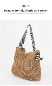 Detail of woven paper straw texture and black and white striped straps on beach bag