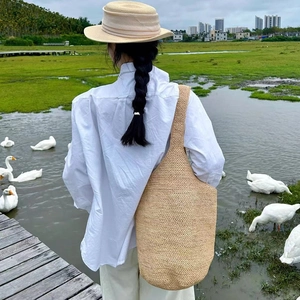 Large capacity raffia bucket bag with woven texture for beach vacation style