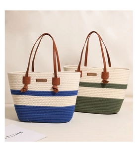 Close-up of woven cotton tote bags with striped patterns and brown leather straps