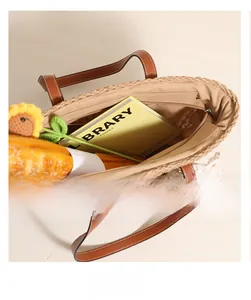 Top view of beige straw tote bag interior showing spacious capacity and smooth zipper