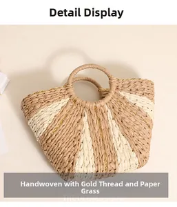 Detail of paper straw woven bag with gold thread and khaki cream color block design
