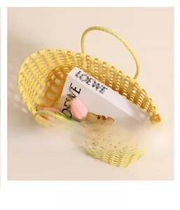 Macro shot of yellow woven plastic basket bag showing spacious interior and hollow grid design