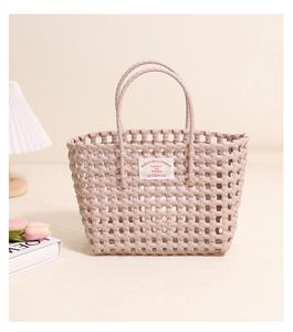 Close-up of the woven texture and American Lifewear logo on the pink plastic beach bag