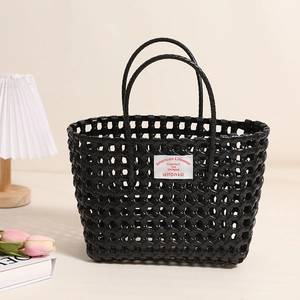 Chic black hollow-out woven plastic tote bag for beach vacation and casual shopping