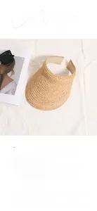 Detail of raffia open-top sun hat featuring 13cm wide brim and flexible headband structure