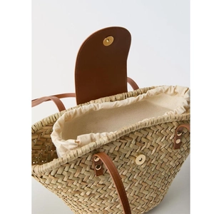 Natural straw tote bag with brown PU leather flap and canvas drawstring liner