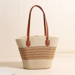 Striped woven straw tote bag with brown leather handles and hollow mesh detail
