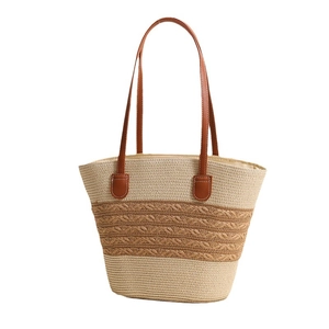Large striped straw tote bag with brown leather handles for summer beach vacation