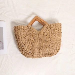 Handmade woven straw handbag with diamond wood handles and metallic gold thread detail