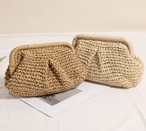 Detailed close-up of woven pleated straw cloud bags in brown and beige summer styles