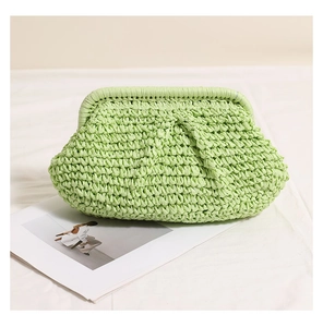 Close-up of light green woven texture and pleated pouch design for a summer beach bag