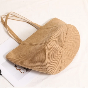 Minimalist straw woven shoulder bag with round bottom for beach and daily vacation use