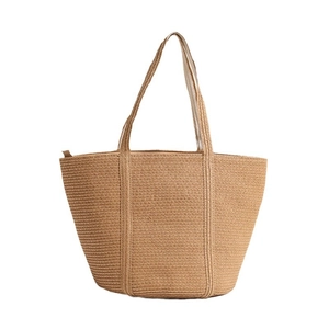 Minimalist straw woven tote bag with wide shoulder straps and zipper for summer beach vacations