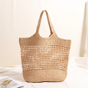 Handwoven beige raffia tote bag with hollow mesh design for summer beach vacations