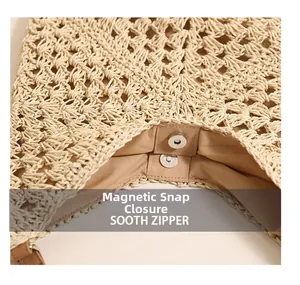 Close-up of the secure magnetic closure and brown fabric lining on the beige woven tote bag