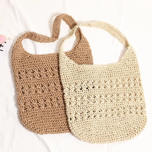 Hollow out woven straw tote bag in brown and beige for beach vacation and summer style