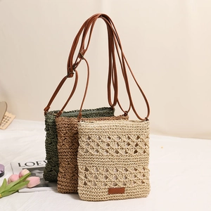 Handwoven crossbody straw bags in beige, brown and green with adjustable leather straps