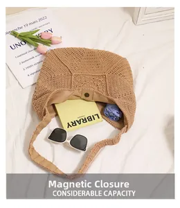 Detailed view of camel woven shoulder bag showing magnetic closure and interior capacity