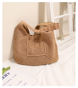 Detail of hand-woven cotton thread pattern and lining on the straw beach tote bag