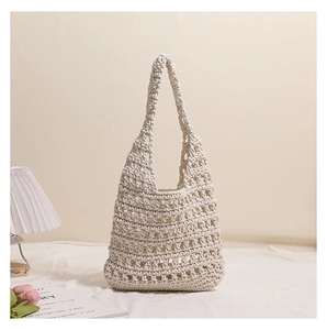 Detailed close-up of cream white crochet tote bag with hollow diamond knit pattern