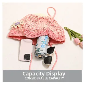 Top view showing the considerable capacity of this pink straw bag with flowers