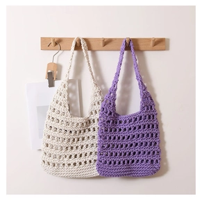 Close-up of handmade hollow woven cotton tote bags in cream white and lavender purple