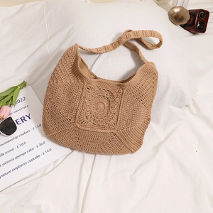 Handcrafted khaki cotton crochet tote bag with radial flower pattern for beach vacation