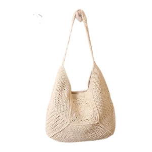 Bohemian beige crochet shoulder bag with hollow flower pattern for beach vacation