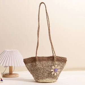 Handwoven gradient straw shoulder bag with floral charm for beach vacation fashion