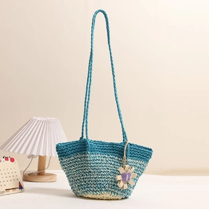 Handmade gradient blue and white straw shoulder bag with floral charm for beach vacation