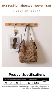 Dettagli borsa in paglia dimensioni 36x21x30cm con nappa e texture intrecciata