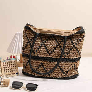 Woven straw tote bag with geometric pattern and round handles for summer vacation